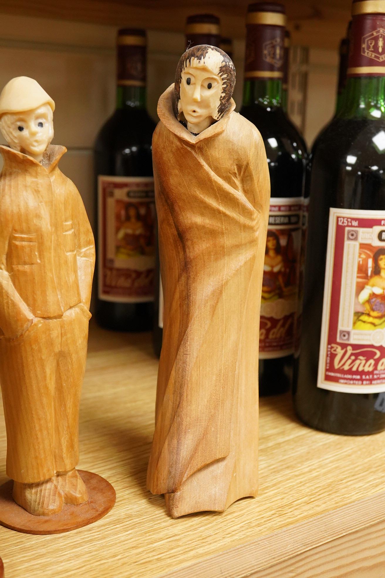 Pierre Decorse (b.1953), a group of four carved figures, tallest 29cm high